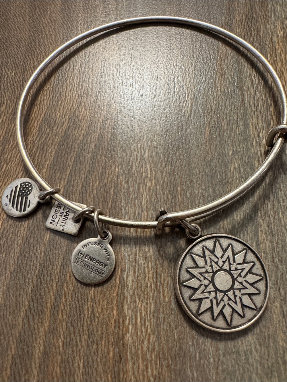 Alex and Ani silver-tone sunburst charm bangle with logo discs
